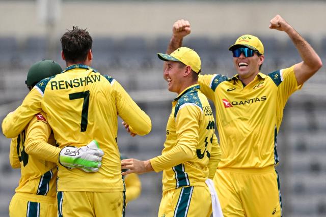 Australia's Matt Renshaw (2L) celebrates with teammates after taking the wicket of Bangladesh's captain Najmul Hossain Shanto during the third one-day international (ODI) cricket match between Bangladesh and Australia at the Sher-e-Bangla National Stadium in Dhaka on June 14, 2026. (Photo by Munir UZ ZAMAN / AFP)