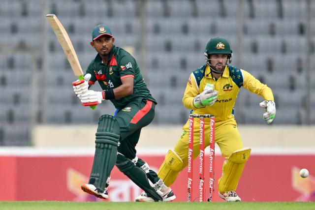 Bangladesh's Mosaddek Hossain (L) watches the ball after playing a shot as Australia's wicketkeeper and captain Josh Inglis fields during the third one-day international (ODI) cricket match between Bangladesh and Australia at the Sher-e-Bangla National Stadium in Dhaka on June 14, 2026. (Photo by Munir UZ ZAMAN / AFP)