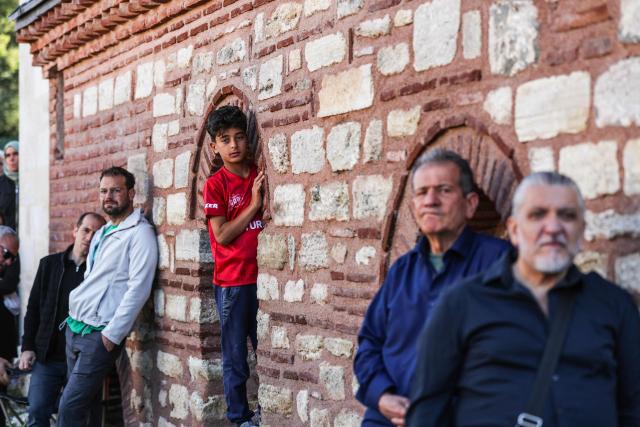 Turkish fans watche a broadcast of the FIFA World Cup 2026 Group D match between Australia and Turkey at the Yedikule fortress, which encloses a section of the ancient Walls of Constantinople, in Istanbul on June 14, 2026. (Photo by BERK OZKAN / AFP)