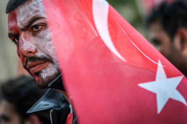 A Turkish fan looks on as he watches a broadcast of the FIFA World Cup 2026 Group D match between Australia and Turkey at the Yedikule fortress, which encloses a section of the ancient Walls of Constantinople, in Istanbul on June 14, 2026. (Photo by BERK OZKAN / AFP)