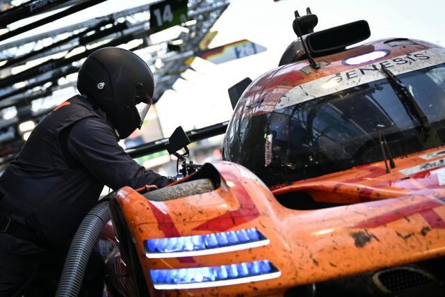 The Korean Genesis GMR-001-Hypercar #19 of GENESIS MAGMA RACING (LMDh) makes a pit stop during the 94th edition of the 24 Hours of Le Mans at the Le Mans circuit, north-western France, on June 14, 2026. (Photo by Lou BENOIST / AFP)
