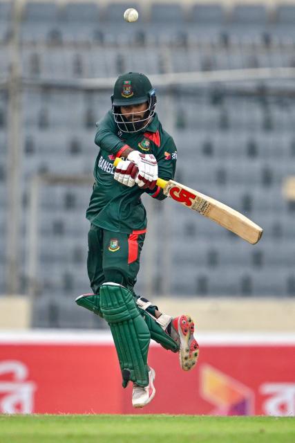 Bangladesh's Towhid Hridoy plays a shot during the third one-day international (ODI) cricket match between Bangladesh and Australia at the Sher-e-Bangla National Stadium in Dhaka on June 14, 2026. (Photo by Munir UZ ZAMAN / AFP)
