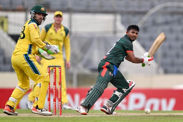 Bangladesh's Mosaddek Hossain (R) watches the ball after playing a shot as Australia's wicketkeeper and captain Josh Inglis fields during the third one-day international (ODI) cricket match between Bangladesh and Australia at the Sher-e-Bangla National Stadium in Dhaka on June 14, 2026. (Photo by Munir UZ ZAMAN / AFP)