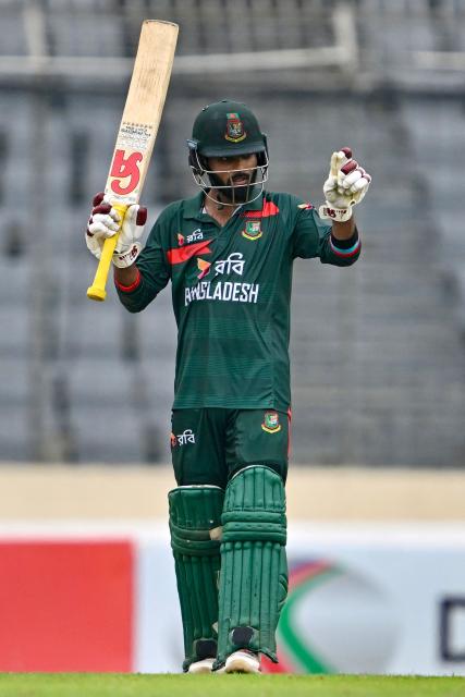 Bangladesh's Towhid Hridoy celebrates after scoring a half-century (50 runs) during the third one-day international (ODI) cricket match between Bangladesh and Australia at the Sher-e-Bangla National Stadium in Dhaka on June 14, 2026. (Photo by Munir UZ ZAMAN / AFP)