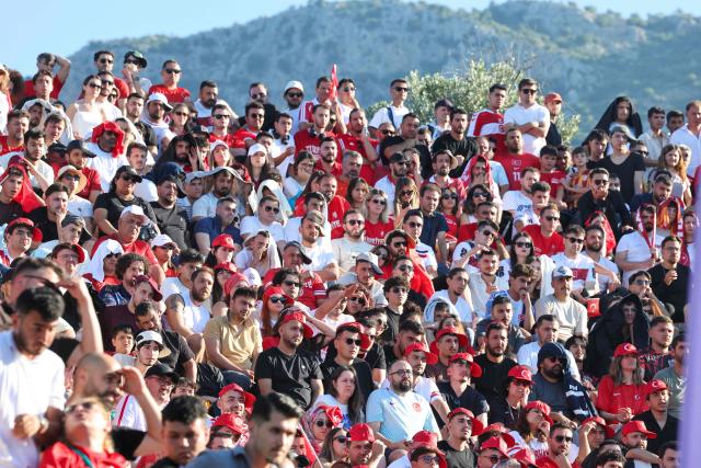 Turkish fans watch a broadcast of the FIFA World Cup 2026 Group D match between Australia and Turkey at the Hellenistic amphitheatre of Antiphellos at Kas district of Antalya on June 14, 2026. (Photo by ONER SAN / AFP)