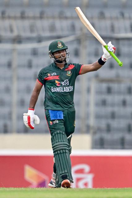Bangladesh's Mosaddek Hossain celebrates after scoring a half-century (50 runs) during the third one-day international (ODI) cricket match between Bangladesh and Australia at the Sher-e-Bangla National Stadium in Dhaka on June 14, 2026. (Photo by Munir UZ ZAMAN / AFP)