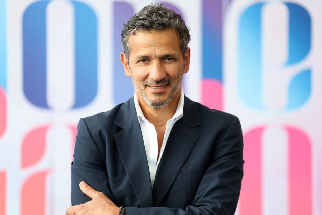 French-Algerian actor Kamel Belghazi poses during a photocall for the TV series "Une famille formidable" as part of the 65th Monte-Carlo Television Festival in the principality of Monaco on June 14, 2026. (Photo by Valery HACHE / AFP)