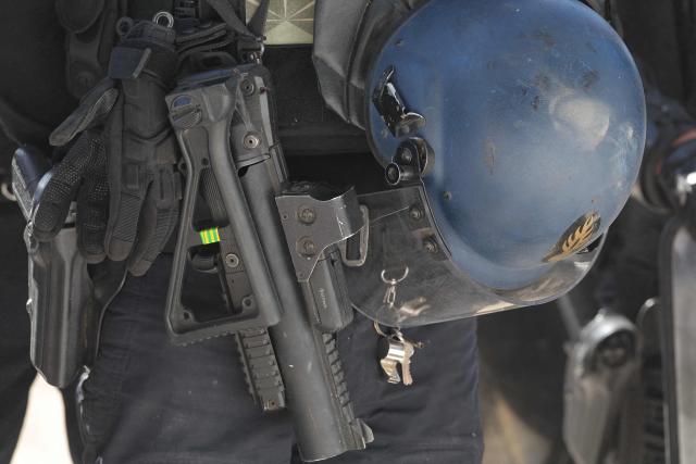 A gendarme holds a less-lethal launcher (LBD) during a dynamic demonstration of military equipment at the Eurosatory defence and security trade show at the Paris Nord Villepinte Exhibition Centre in Villepinte, a northeastern suburb of Paris, on June 14, 2026. The Eurosatory trade show takes place from June 15 to 19, 2026. (Photo by Kenzo TRIBOUILLARD / AFP)