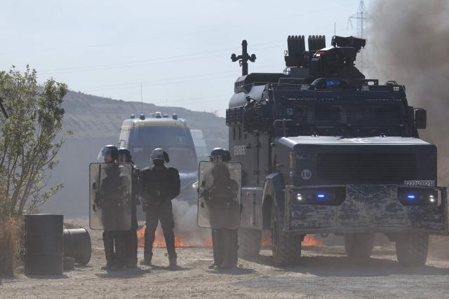Gendarmes of the Armoured Mobile Gendarmerie Unit (GBGM) participate in a military equipment demonstration at the Eurosatory defence and security trade show at the Paris Nord Villepinte Exhibition Centre in Villepinte, a northeastern suburb of Paris, on June 14, 2026. The Eurosatory trade show takes place from June 15 to 19, 2026. (Photo by Kenzo TRIBOUILLARD / AFP)