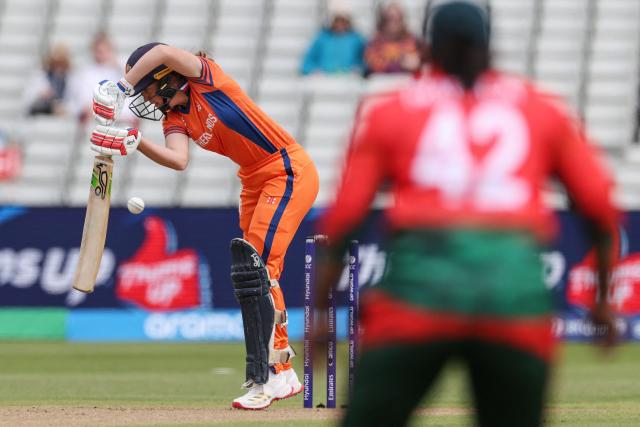 Netherlands' Phebe Molkenboer (L) edges the ball to be caught out behind, during the ICC Women's T20 cricket World Cup 2026 Group A stage, Match 5 match between the Netherlands and Bangladesh at Edgbaston cricket ground in Birmingham, central England on June 14, 2026. (Photo by Darren Staples / AFP)