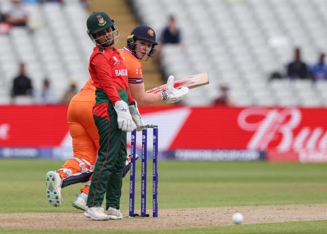 Netherlands' Heather Siegers (behind) plays a shot as Bangladesh's wicketkeeper Nigar Sultana (front) looks on, during the ICC Women's T20 cricket World Cup 2026 Group A stage, Match 5 match between the Netherlands and Bangladesh at Edgbaston cricket ground in Birmingham, central England on June 14, 2026. (Photo by Darren Staples / AFP)