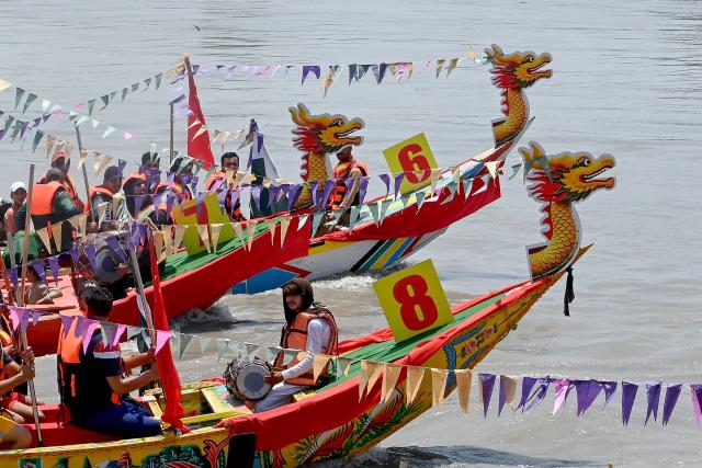 Pakistanis participate in the Chinese Dragon Boat Festival, organised under cultural exchange between two countries, in Pakistan's Charsadda on June 14, 2026. (Photo by Abdul MAJEED / AFP)