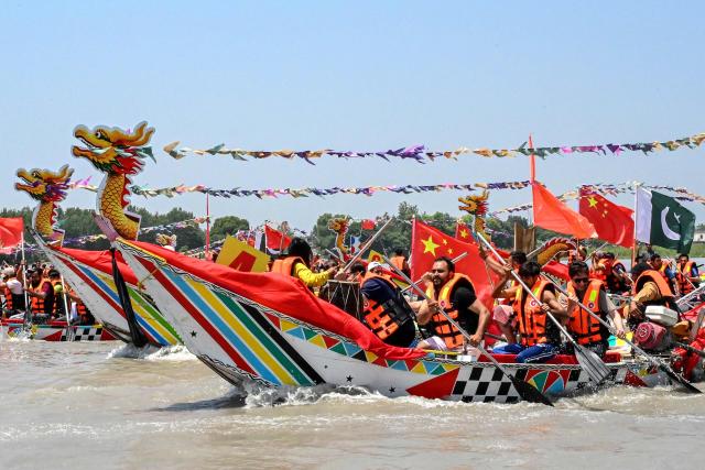 Pakistanis participate in the Chinese Dragon Boat Festival, organised under cultural exchange between two countries, in Pakistan's Charsadda on June 14, 2026. (Photo by Abdul MAJEED / AFP)