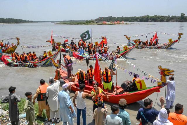 Pakistanis participate in the Chinese Dragon Boat Festival, organised under cultural exchange between two countries, in Pakistan's Charsadda on June 14, 2026. (Photo by Abdul MAJEED / AFP)