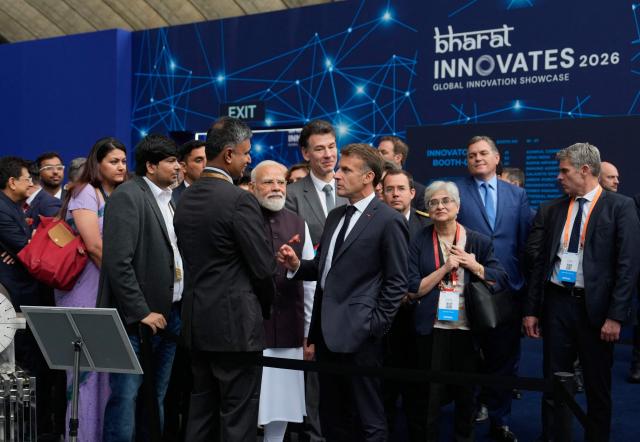 India's Prime Minister Narendra Modi and France's President Emmanuel Macron talks with attendees during the "Bharat Innovate 2026" event in Nice south-eastern France on June 14, 2026. (Photo by Lewis JOLY / POOL / AFP)