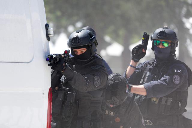 French policemen of the Search and Intervention Brigade (BRI) participate during a dynamic demonstration of military equipment at the Eurosatory trade show, dedicated to defense and security, at the Paris Nord Villepinte Exhibition Center in Villepinte, northeastern suburb of Paris on June 14, 2026. The Eurosatory trade show takes place from June 15 to 19, 2026. (Photo by Kenzo TRIBOUILLARD / AFP)