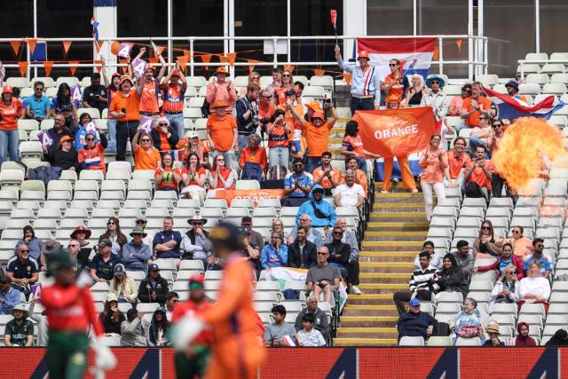 Netherlands suppporters cheer on their team during the ICC Women's T20 cricket World Cup 2026 Group A stage, Match 5 match between the Netherlands and Bangladesh at Edgbaston cricket ground in Birmingham, central England on June 14, 2026. (Photo by Darren Staples / AFP)