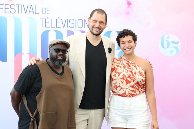 French-Malian actor Issa Doumbia (L) French magician Eric Antoine (C) and Vaimala Chaves (R)pose during a photocall for the TV series "Les traitres" as part of the 65th Monte-Carlo Television Festival in the principality of Monaco on June 14, 2026. (Photo by Valery HACHE / AFP)