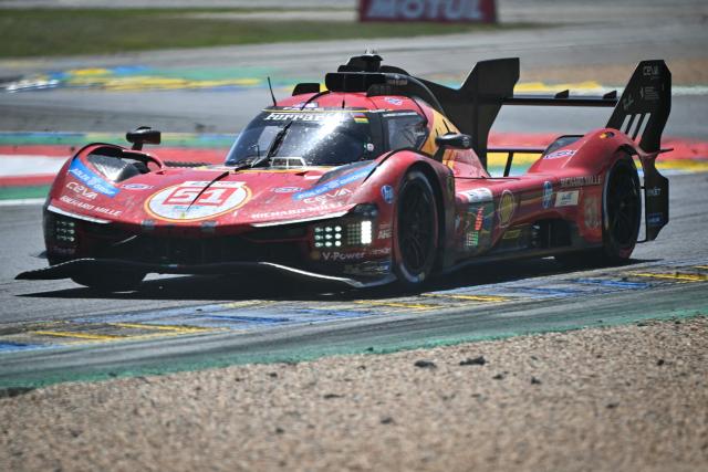 The Ferrari AF Corse's car of Italian driver Alessandro Pier Guidi, British driver James Calado and Italian driver Antonio Giovinazzi takes a corner during the 94th edition of the 24 Hours of Le Mans at the Le Mans circuit, north-western France, on June 14, 2026. (Photo by Lou BENOIST / AFP)