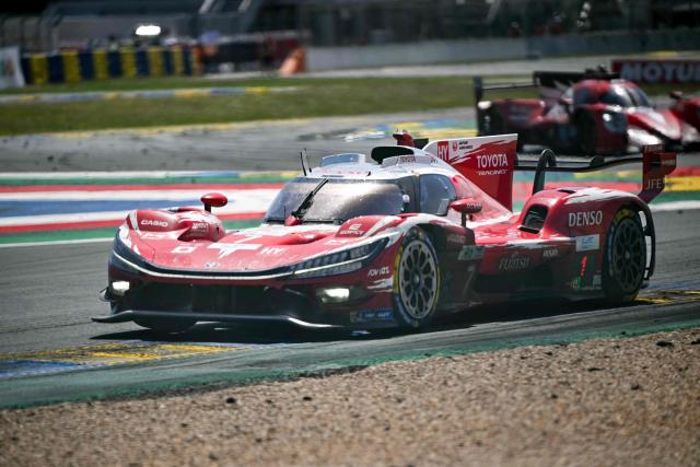The Toyota Racing's car of British driver Mike Conway, Japanese driver Kamui Kobayashi and Dutch driver Nyck de Vriestakes a corner during the 94th edition of the 24 Hours of Le Mans at the Le Mans circuit, north-western France, on June 14, 2026. (Photo by Lou BENOIST / AFP)