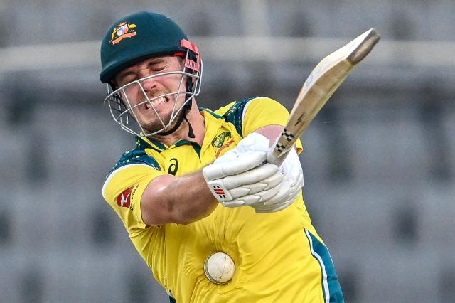 Australia's Cameron Green reacts after being hit by the ball during the third one-day international (ODI) cricket match between Bangladesh and Australia at the Sher-e-Bangla National Stadium in Dhaka on June 14, 2026. (Photo by Munir UZ ZAMAN / AFP)