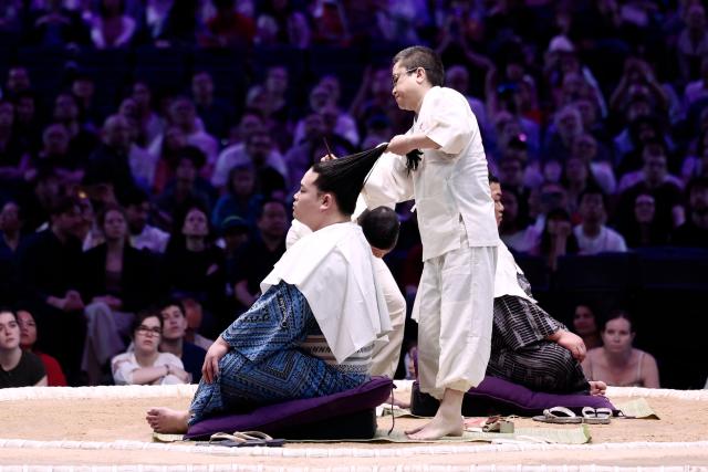 Sekitori take part in a traditional hairstyle demonstration on day 2 of the 2026 Paris Sumo Tournament, in Paris on June 14, 2026. (Photo by Behrouz MEHRI / AFP)