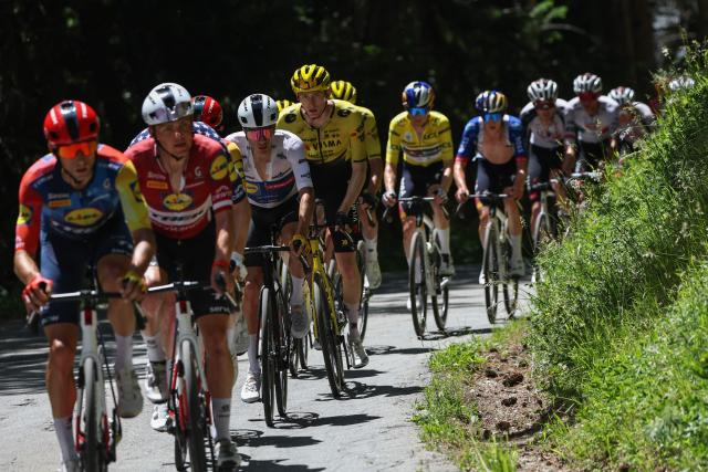Team Visma | Lease a Bike's US rider Matteo Jorgenson cycles with the pack of riders during the 8th and final stage of the Tour Auvergne-Rhone-Alpes cycling race (formerly known as the Criterium du Dauphine), 120,1km between Beaufort and Plateau de Solaison, in the French Alps on June 14, 2026. (Photo by Anne-Christine POUJOULAT / AFP)