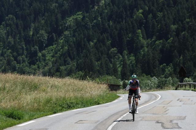 Decathlon CMA CGM Team's French rider Paul Seixas drops behind the pack of riders cycles during the 8th and final stage of the Tour Auvergne-Rhone-Alpes cycling race (formerly known as the Criterium du Dauphine), 120,1km between Beaufort and Plateau de Solaison, in the French Alps on June 14, 2026. Decathlon CMA CGM Team's French rider Paul Seixas withdrew from the race early on the final 8th stage after suffering a crash one day prior. (Photo by Anne-Christine POUJOULAT / AFP)