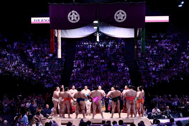 Sumo wrestlers are introduced on day 2 of the 2026 Paris Sumo Tournament, in Paris on June 14, 2026. (Photo by Behrouz MEHRI / AFP)