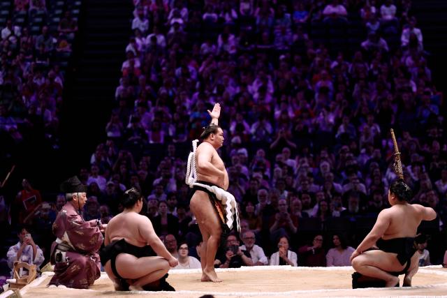 Mongolian Yokozuna (Grand Champion) Hoshoryu performs during the Yokozuna belt-tying ceremony on day 2 of the 2026 Paris Sumo Tournament, in Paris on June 14, 2026. (Photo by Behrouz MEHRI / AFP)
