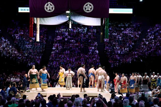 Sumo wrestlers are introduced on the dohy? on day 2 of the 2026 Paris Sumo Tournament, in Paris on June 14, 2026. (Photo by Behrouz MEHRI / AFP)
