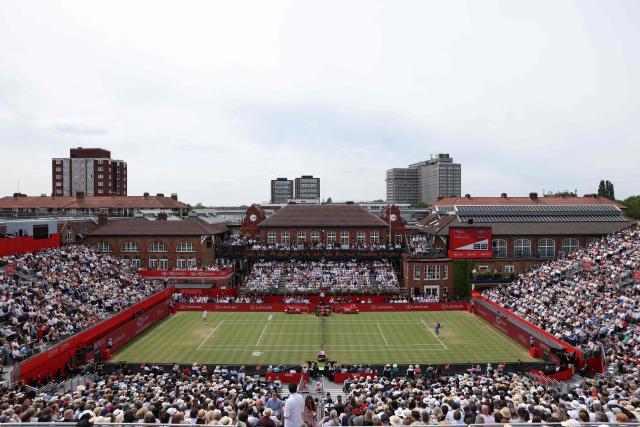 Britain's Emma Raducanu (R) serves to Croatia's Donna Vekic during their women's singles final tennis match at the HSBC WTA Championships at Queen's Club in west London on June 14, 2026. (Photo by Adrian DENNIS / AFP)