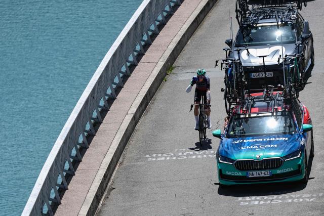 Decathlon CMA CGM Team's French rider Paul Seixas cycles over the Barrage de Roselend during the 8th and final stage of the Tour Auvergne-Rhone-Alpes cycling race (formerly known as the Criterium du Dauphine), 120,1km between Beaufort and Plateau de Solaison, in the French Alps on June 14, 2026. Decathlon CMA CGM Team's French rider Paul Seixas withdrew from the race early on the final 8th stage after suffering a crash one day prior. (Photo by Anne-Christine POUJOULAT / AFP)