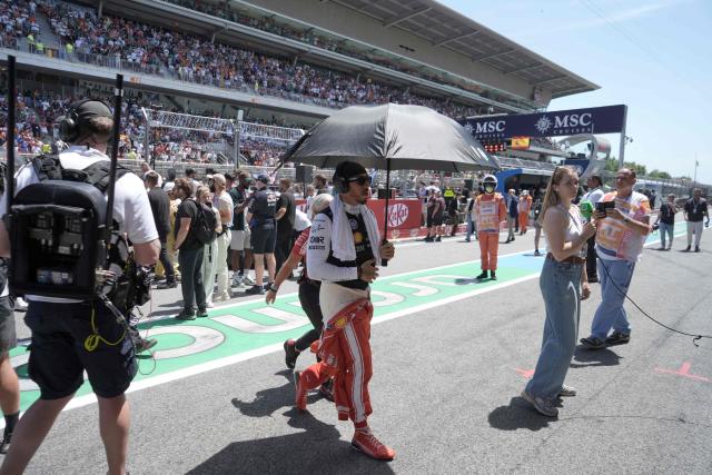 Ferrari's British driver Lewis Hamilton arrives prior the Catalonia Formula One Grand Prix at the Circuit de Catalunya in Montmelo, on the outskirts of Barcelona, on June 14, 2026. (Photo by Manaure QUINTERO / AFP)