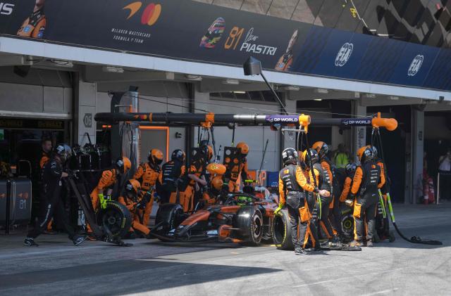 Technician work on McLaren British driver Lando Norris's car at the pit stop during the Catalonia Formula One Grand Prix at the Circuit de Catalunya in Montmelo, on the outskirts of Barcelona, on June 14, 2026. (Photo by Manaure QUINTERO / POOL / AFP)