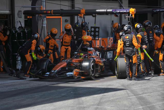 Technician work on McLaren Australian driver Oscar Piastri's car at the pit stop during the Catalonia Formula One Grand Prix at the Circuit de Catalunya in Montmelo, on the outskirts of Barcelona, on June 14, 2026. (Photo by Manaure QUINTERO / POOL / AFP)
