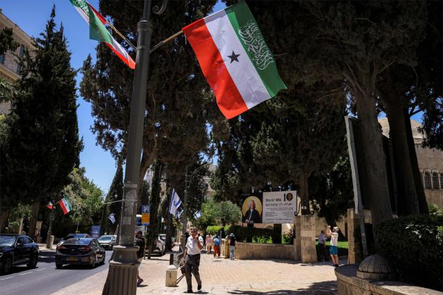 Flags of Somalia's breakaway region of Somaliland fly along a street in western Jerusalem on June 14, 2026. Somaliland's President Abdirahman Mohamed Abdullahi met his Israeli counterpart on June 14 in Jerusalem in his first-ever state visit, which comes months after Israel officially recognised the breakaway African state. In December 2025, Israel became the first country to recognise the independence of Somaliland since it declared its autonomy from Somalia in 1991 following a civil war. (Photo by HAZEM BADER / AFP)