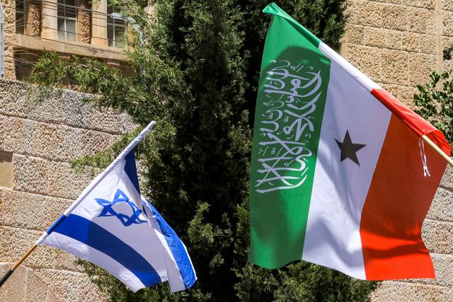Flags of Somalia's breakaway region of Somaliland fly alongside Israeli flags on a street in western Jerusalem on June 14, 2026. Somaliland's President Abdirahman Mohamed Abdullahi met his Israeli counterpart on June 14 in Jerusalem in his first-ever state visit, which comes months after Israel officially recognised the breakaway African state. In December 2025, Israel became the first country to recognise the independence of Somaliland since it declared its autonomy from Somalia in 1991 following a civil war. (Photo by HAZEM BADER / AFP)