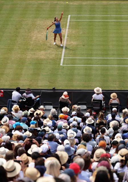 Britain's Emma Raducanu serves against Croatia's Donna Vekic during their women's singles final tennis match at the HSBC WTA Championships at Queen's Club in west London on June 14, 2026. (Photo by Adrian Dennis / AFP)