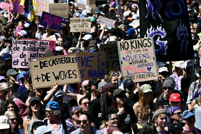 Demonstrators hold placards during a demonstration of a "No-G7" coalition of over 60 associations, unions and left-wing groups "against fascism and imperialism, a day ahead of the summit's start, in Geneva on June 14, 2026. The 2026 edition of the G7 summit is set to take place June 15 to 17 in the French town of Evian-les-Bains near Switzerland, attended by country leaders as well as the EU's foreign policy chief and ministers from Brazil, Canada, the United Arab Emirates and Turkey. (Photo by Fabrice COFFRINI / AFP)