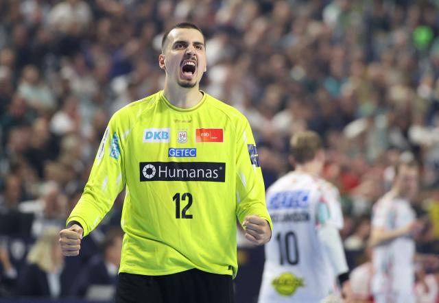 SC Magdeburg's Croatian goalkeeper Matej Mandic reacts during the EHF Men's Handball Champions League Final 4 third place match between Aalborg Handbold and SC Magdeburg in Cologne, western Germany on June 14, 2026. (Photo by Ronny HARTMANN / AFP)