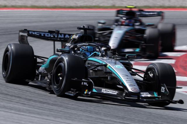 Mercedes' British driver George Russell drives ahead of Mercedes' Italian driver Kimi Antonelli during the Catalonia Formula One Grand Prix at the Circuit de Catalunya in Montmelo, on the outskirts of Barcelona, on June 14, 2026. (Photo by Lluis GENE / AFP)