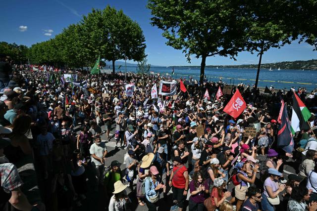 Demonstrators take part in a rally of a "No-G7" coalition of over 60 associations, unions and left-wing groups "against fascism and imperialism”, a day ahead of the summit's start,  in Geneva on June 14, 2026. The 2026 edition of the G7 summit is set to take place June 15 to 17 in the French town of Evian-les-Bains near Switzerland, attended by country leaders as well as the EU's foreign policy chief and ministers from Brazil, Canada, the United Arab Emirates and Turkey. (Photo by Fabrice COFFRINI / AFP)