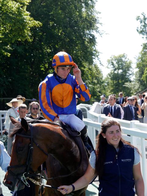 English jockey Ryan Moore gestures as he celebrates after victory on 'Diamond Necklace' at the 177th Prix de Diane horse race in Chantilly, north of Paris on June 14, 2026. (Photo by GEOFFROY VAN DER HASSELT / AFP)