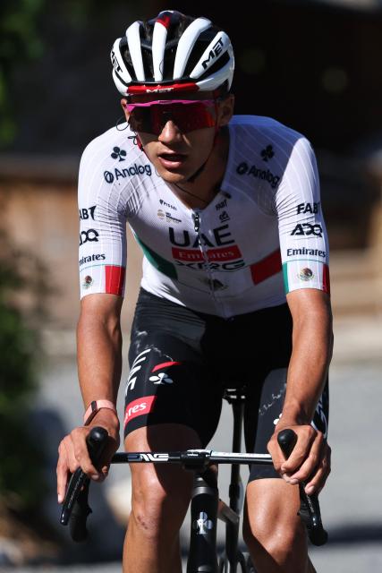 UAE Team Emirates XRG's Mexican rider Isaac Del Toro Romero cycles in a breakaway during the 8th and final stage of the Tour Auvergne-Rhone-Alpes cycling race (formerly known as the Criterium du Dauphine), 120,1km between Beaufort and Plateau de Solaison, in the French Alps on June 14, 2026. (Photo by Anne-Christine POUJOULAT / AFP)