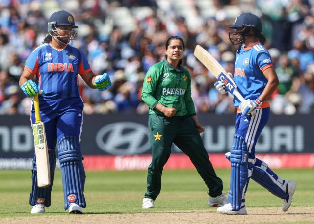 Pakistan's captain Fatima Sana (C) celebrates after dismissing India's captain Harmanpreet Kaur (R) during the ICC Women's T20 cricket World Cup 2026 Group A stage, Match 6 match between the India and Pakistan at Edgbaston cricket ground in Birmingham, central England on June 14, 2026. (Photo by Darren Staples / AFP)