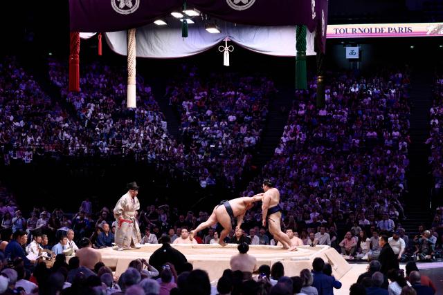 Yokozuna-ranked Onosato (R) during a bout on day 2 of the 2026 Paris Sumo Tournament, in Paris on June 14, 2026. (Photo by Behrouz MEHRI / AFP)