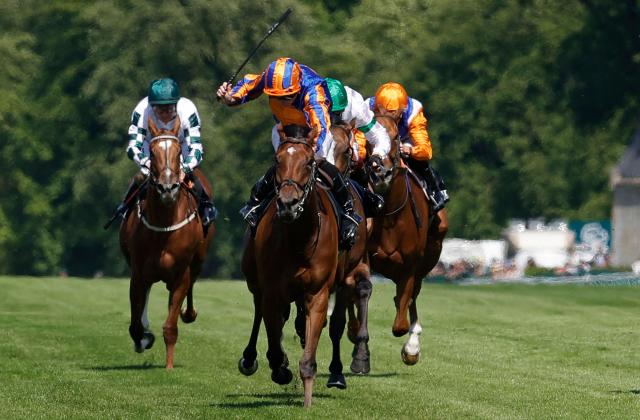 English jockey Ryan Moore (C) rides 'Diamond Necklace' to victory ahead of third placed Irish jockey Oisin Murphy on Inis Mor (C/OBSCURED) at the 177th Prix de Diane horse race in Chantilly, north of Paris on June 14, 2026. (Photo by GEOFFROY VAN DER HASSELT / AFP)