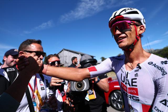 UAE Team Emirates XRG's Mexican rider Isaac Del Toro Romero celebrates winning the 8th and final stage of the Tour Auvergne-Rhone-Alpes cycling race (formerly known as the Criterium du Dauphine), 120,1km between Beaufort and Plateau de Solaison, in the French Alps on June 14, 2026. (Photo by Anne-Christine POUJOULAT / AFP)