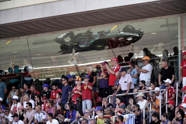 Mercedes' British driver George Russell's car is pictured in a window's reflect as he competes in the Catalonia Formula One Grand Prix at the Circuit de Catalunya in Montmelo, on the outskirts of Barcelona, on June 14, 2026. (Photo by Manaure Quintero / AFP)